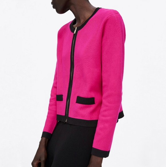 pink cardigan with black trim